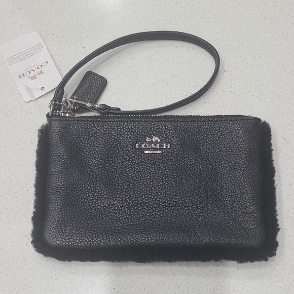 Coach Handbags - NWT Coach Black Pebbled Leather Wristlet With Shearling Trim
